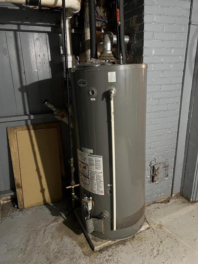 utility room with gas water heater