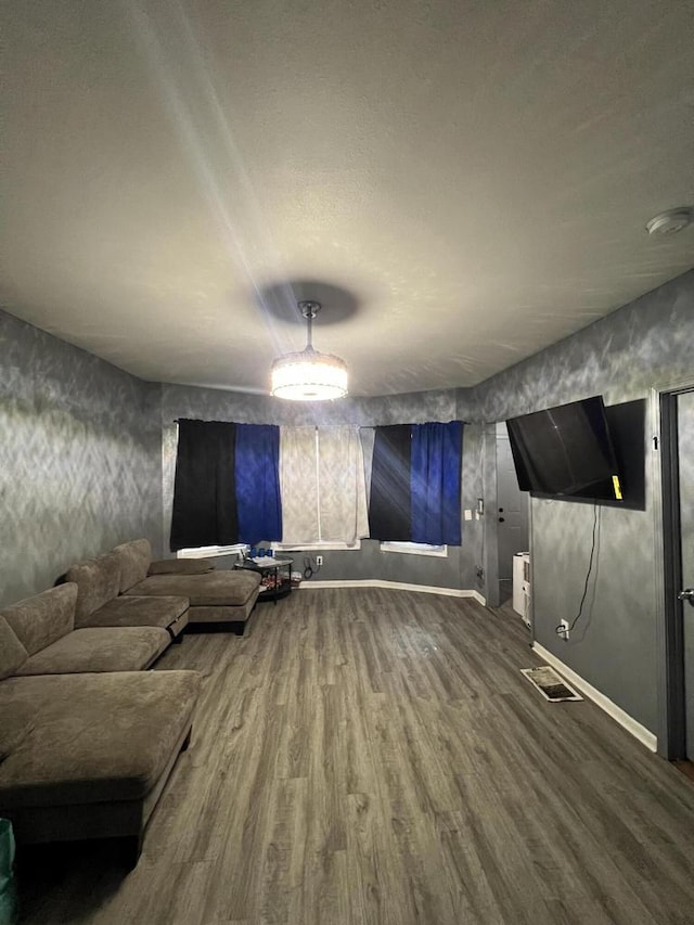 unfurnished living room featuring hardwood / wood-style flooring