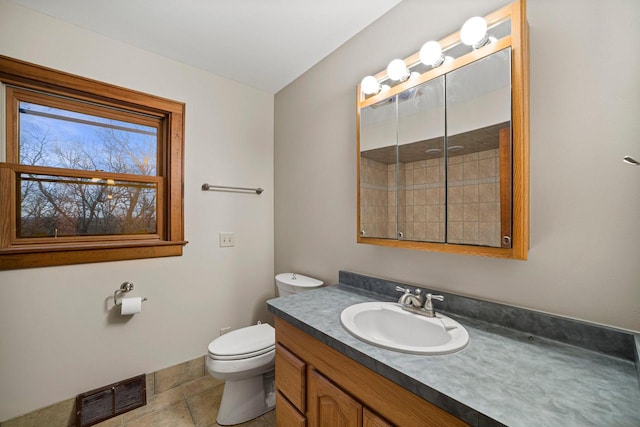 bathroom with tile patterned floors, vanity, and toilet