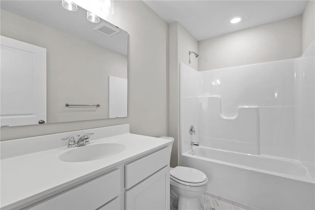 full bathroom featuring vanity, bathing tub / shower combination, and toilet