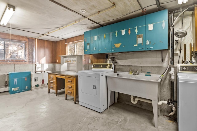 laundry area featuring washer and clothes dryer and sink