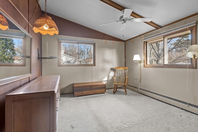 living area featuring carpet flooring, a wealth of natural light, ceiling fan, and lofted ceiling