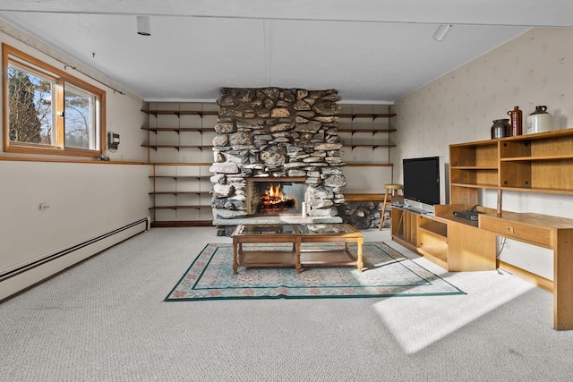 interior space with a fireplace and a baseboard heating unit