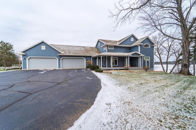 view of front of house with covered porch and a garage