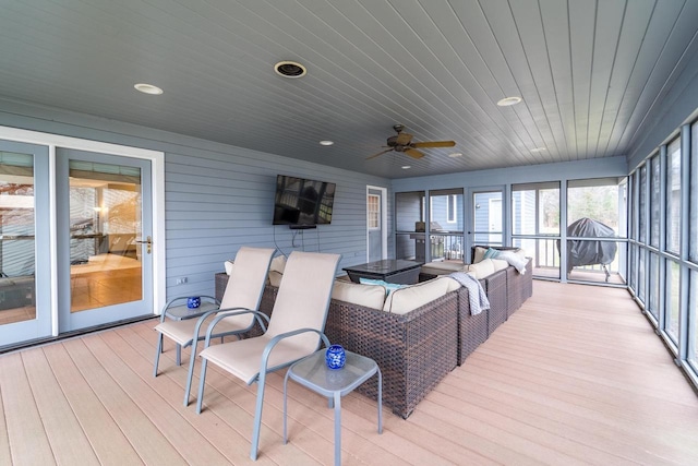 sunroom / solarium with ceiling fan and wood ceiling