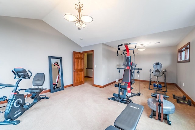 workout area featuring carpet flooring and vaulted ceiling