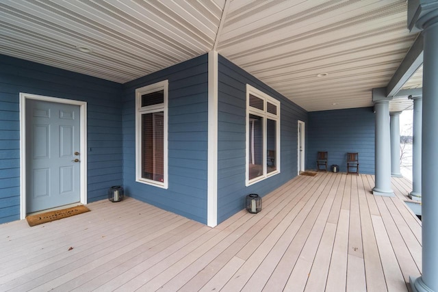 wooden terrace with a porch