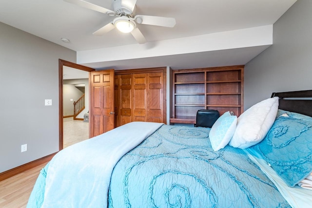 bedroom with ceiling fan and light hardwood / wood-style flooring