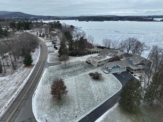 snowy aerial view with a mountain view