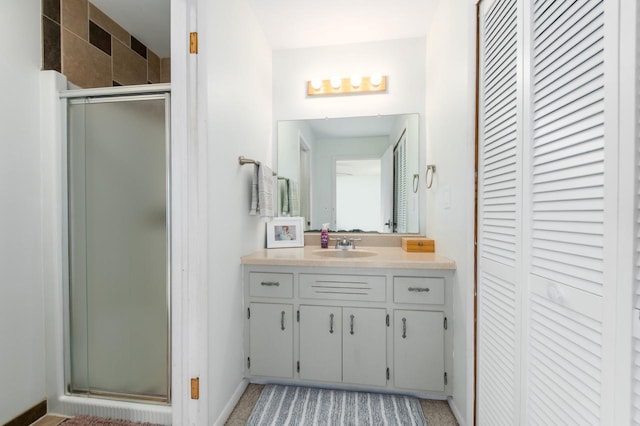 bathroom with vanity and an enclosed shower