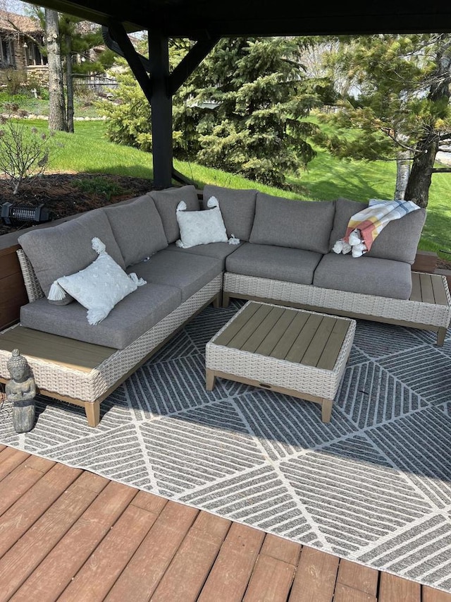 view of patio featuring an outdoor living space and a wooden deck