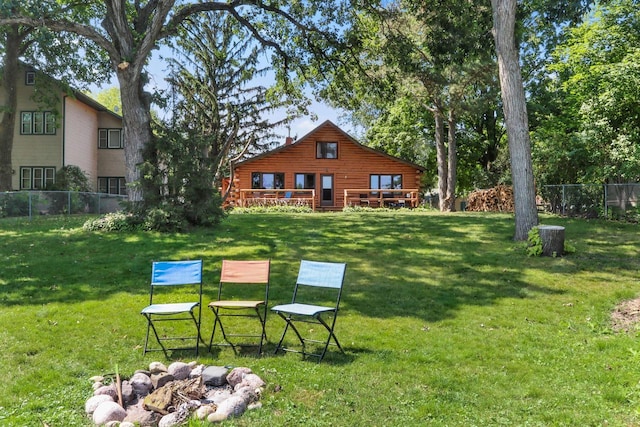 view of yard with an outdoor fire pit