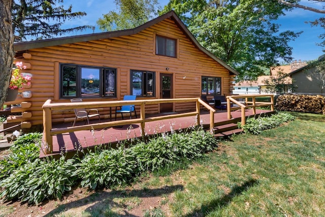 back of property with a wooden deck