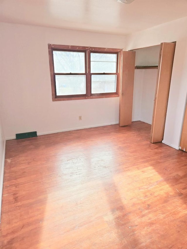 unfurnished bedroom featuring light hardwood / wood-style floors