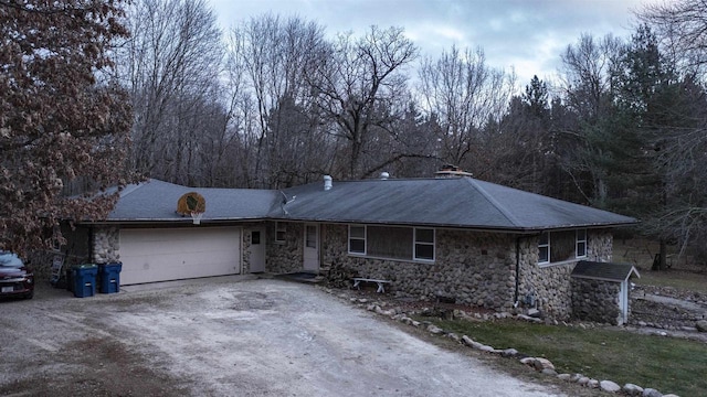 ranch-style home featuring a garage