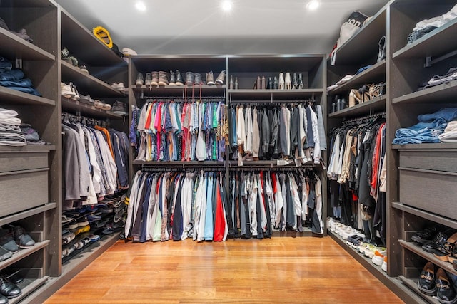 spacious closet featuring hardwood / wood-style flooring