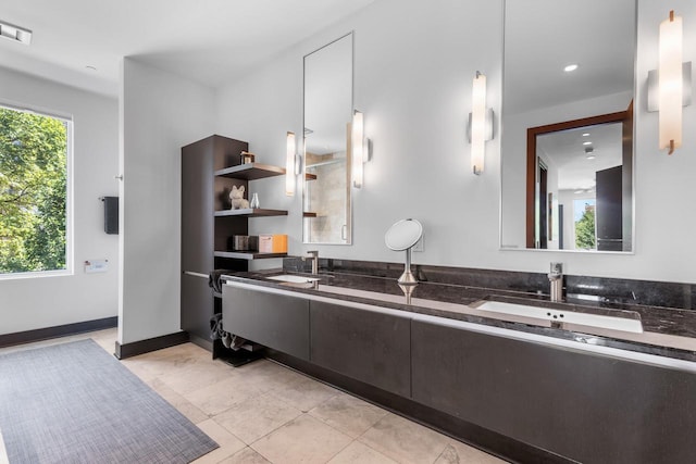 bathroom with tile patterned flooring and vanity