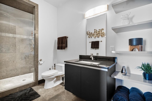 bathroom featuring a shower with door, vanity, and toilet