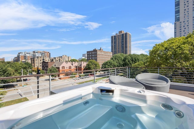 view of swimming pool featuring an outdoor hot tub