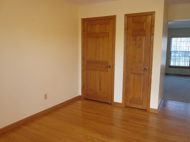 unfurnished bedroom featuring light hardwood / wood-style flooring