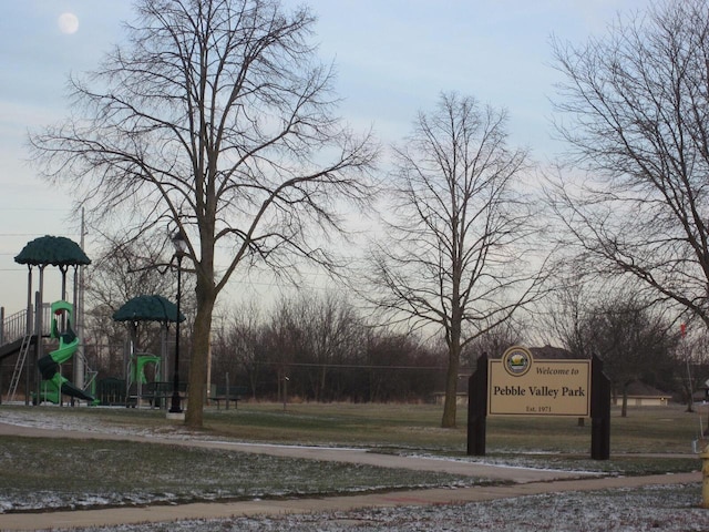 view of property's community with a playground