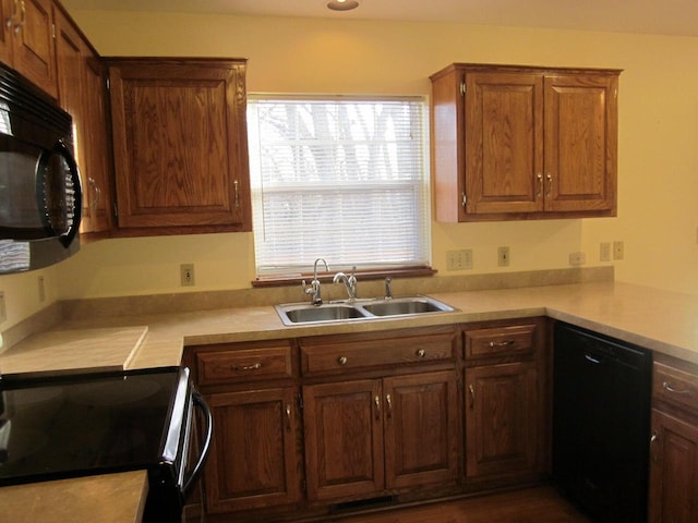 kitchen featuring sink and black appliances