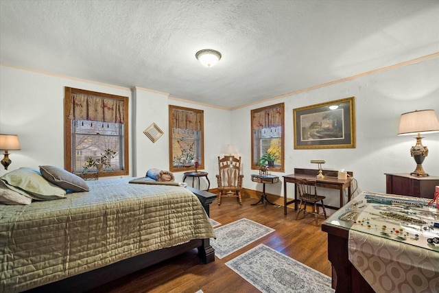 bedroom featuring crown molding, dark hardwood / wood-style flooring, and a textured ceiling