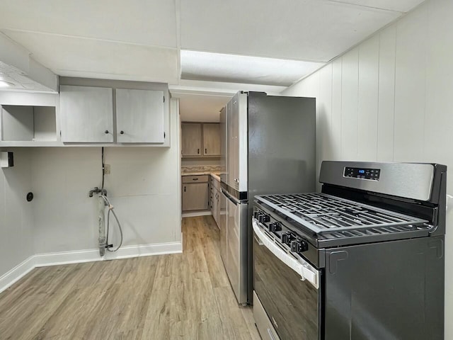 kitchen featuring light wood-type flooring and appliances with stainless steel finishes