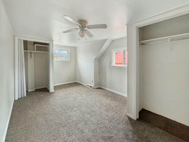 unfurnished bedroom featuring ceiling fan and carpet floors