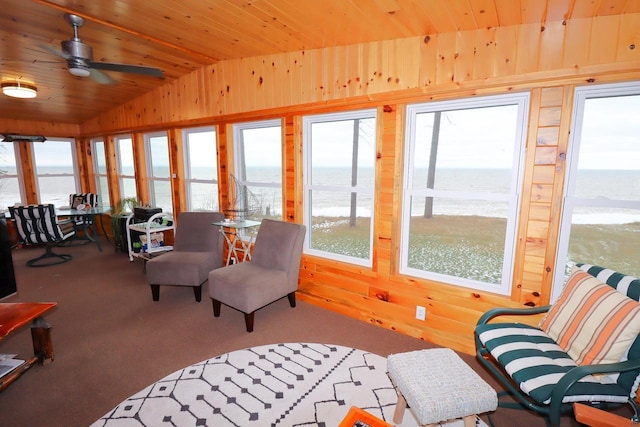 sunroom with a water view, wood ceiling, and lofted ceiling