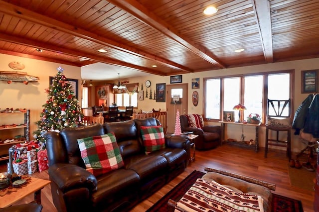 living room with beamed ceiling, wood-type flooring, wooden ceiling, and a notable chandelier