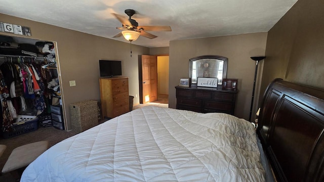 bedroom featuring ceiling fan, a closet, and light carpet