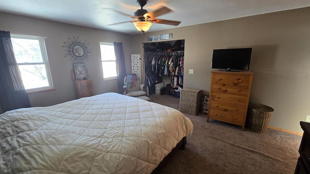 carpeted bedroom featuring ceiling fan, a closet, and multiple windows