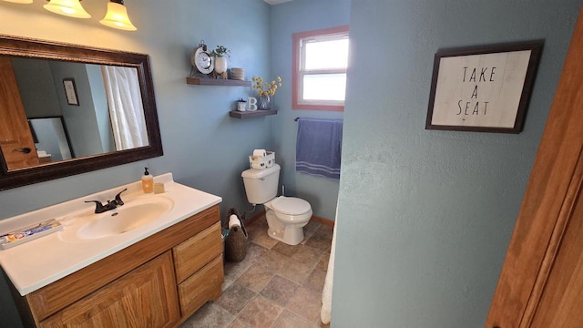 bathroom with vanity and toilet