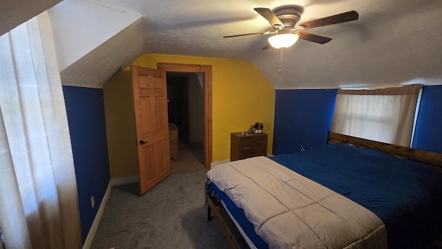 bedroom with ceiling fan, carpet floors, and lofted ceiling