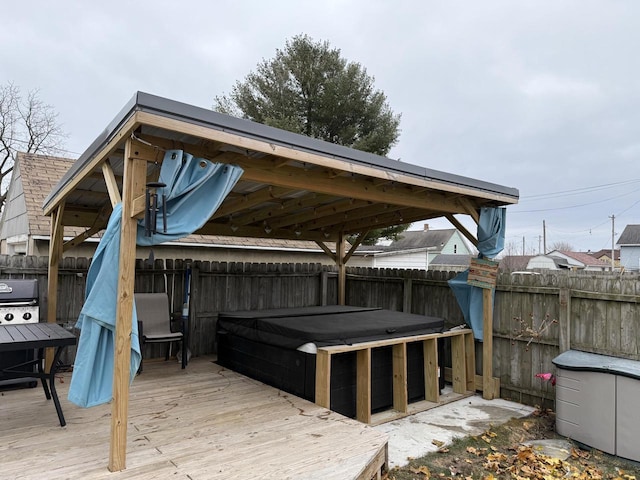 wooden deck with a grill