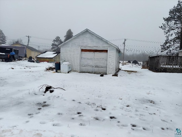 view of snow covered garage