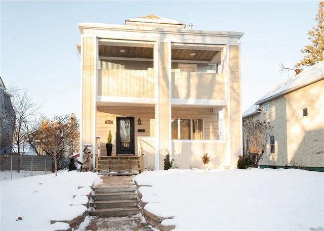 view of front of property with a balcony