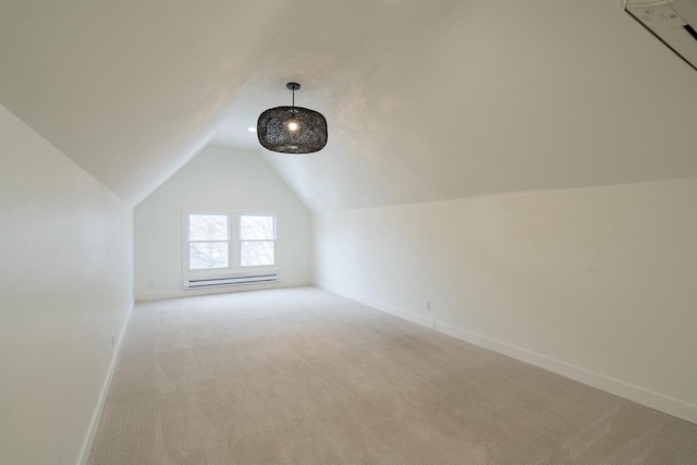 additional living space featuring lofted ceiling and light carpet