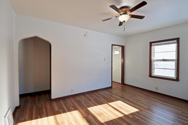 unfurnished room featuring dark hardwood / wood-style floors and ceiling fan