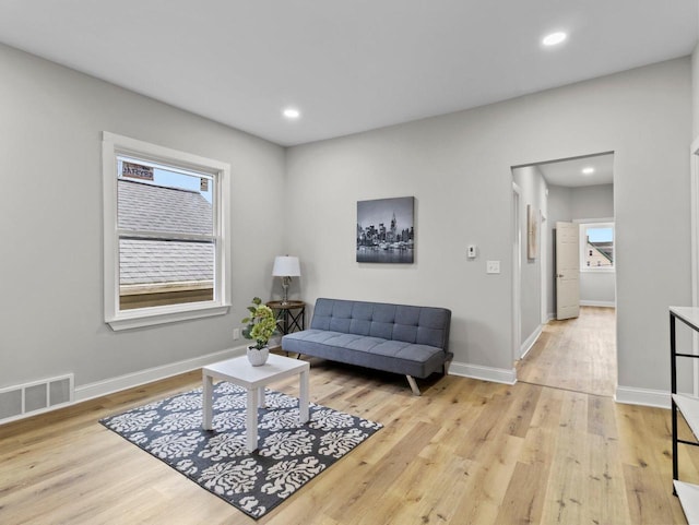 living area with light hardwood / wood-style flooring