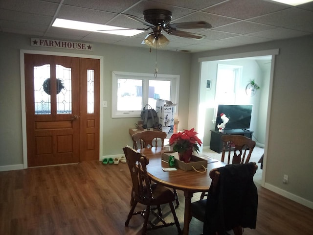 dining area featuring wood finished floors, a wealth of natural light, and ceiling fan