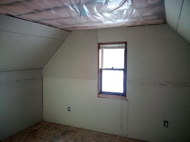 bonus room featuring lofted ceiling