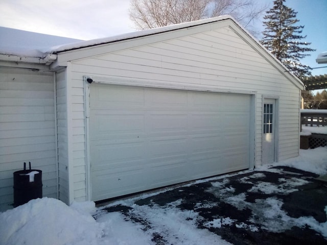 view of snow covered garage