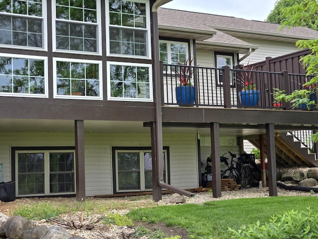 back of house with a wooden deck