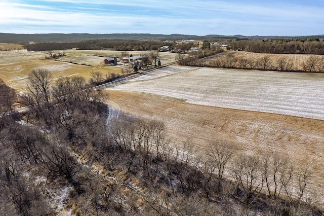 birds eye view of property with a rural view