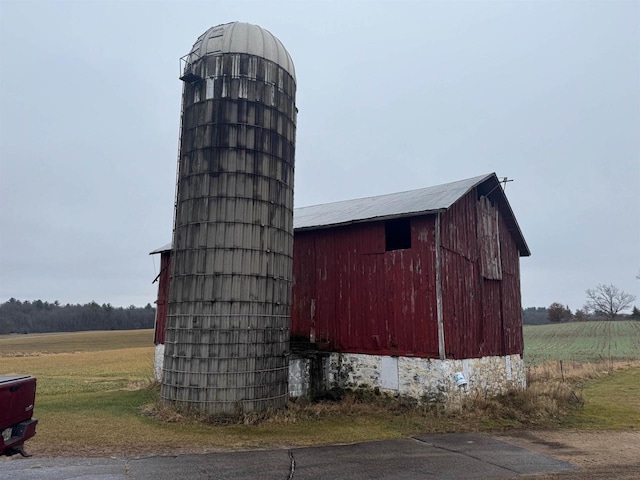 view of outbuilding with a rural view