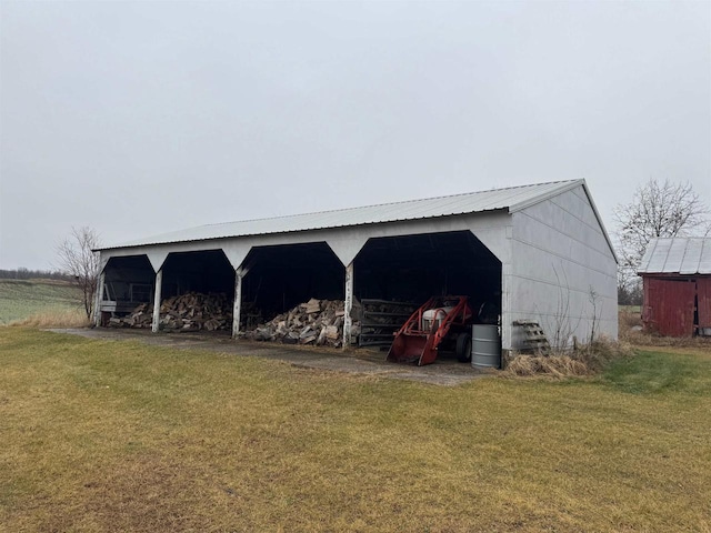 view of outdoor structure with a lawn