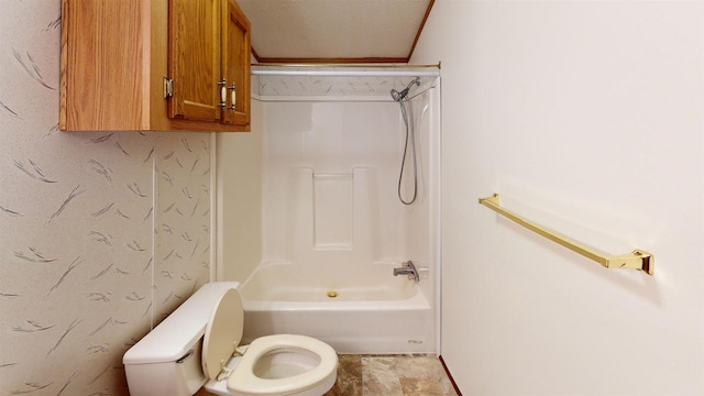 bathroom with shower / bathtub combination and toilet