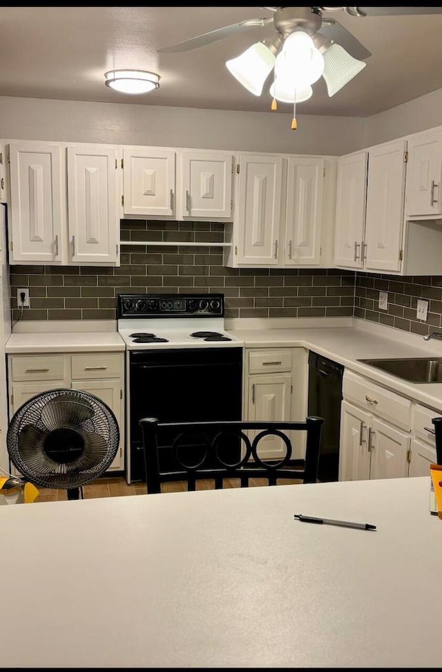 kitchen featuring decorative backsplash, black dishwasher, white cabinetry, and white range with electric stovetop